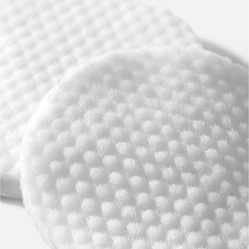 Pestle & Mortar Pore Reset Pads, textured white exfoliating cotton pads shown close up, round and square shapes visible