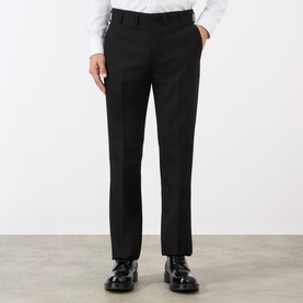 Model wearing Prada Gabardine Tailored Trousers in black, slim-leg with pressed creases, styled with black leather shoes and white shirt.