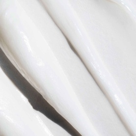 Pureology Strength Cure Hair Treatment Mask texture close-up showing thick, creamy white consistency