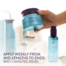 Pureology Strength Cure Hair Treatment Mask held by hand, with matching haircare products in background and usage instructions overlaid.