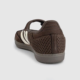 Brown mesh low-top trainer with cream stripe detail, hook-and-loop strap, and grey rubber sole, rear three-quarter view
