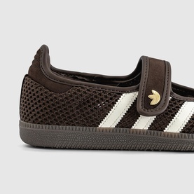 Adidas Samba trainer in dark brown mesh with cream stripes, velcro strap, gold logo badge, and grey rubber sole