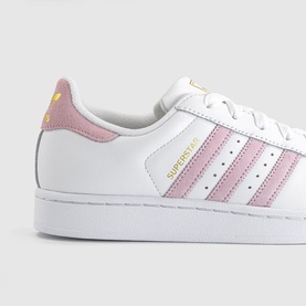 Adidas Superstar trainers in white with clear pink three-stripe detailing, gold branding, white rubber shell toe sole