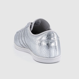 Adidas silver metallic crinkled leather trainer, white rubber sole, three-stripe detail, rear three-quarter view
