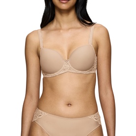 Model wearing Triumph Full Cup Bra in Skin, styled with matching lace-trim briefs. Smooth cups with delicate lace detail at sides.