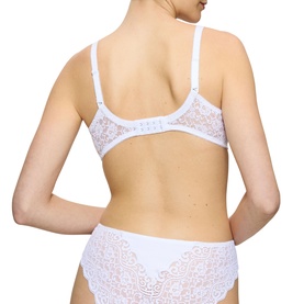 Model wearing Triumph white full cup bra with lace detailing, shown from behind, paired with matching white lace briefs.
