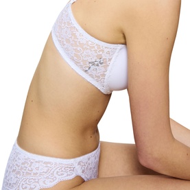 Model wearing Triumph Full Cup Bra in white with floral lace detailing, styled with matching white lace briefs.