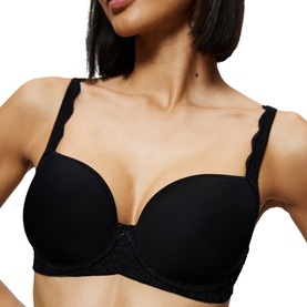 Model wearing Triumph Full Cup Bra in black with smooth cups and delicate scalloped lace trim along the straps and band.
