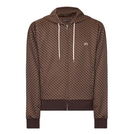 Wales Bonner Brown/Caramel zip-up hoodie with all-over geometric monogram print, ribbed cuffs, drawstring hood, and small logo badge.
