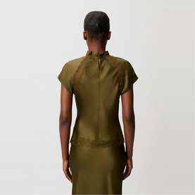 Model wearing Claude Pierlot Womens French Dress in brown satin with ruffle high neck, cap sleeves and lace trim detail, back view