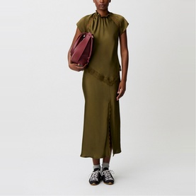 Model wearing Claude Pierlot Womens French Dress in brown, styled with a burgundy shoulder bag and black sandals with white socks.