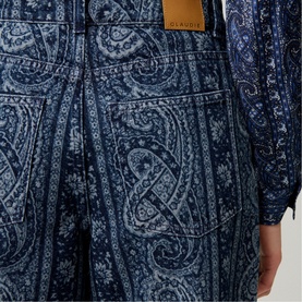 Model wearing Claude Pierlot navy print paisley wide-leg trousers with matching printed shirt