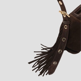Maje dark brown suede bag close-up showing fringe tassel detail with gold-tone eyelet trim and clip hardware.