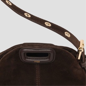 Maje dark brown suede bag with gold-tone disc stud strap detail and zip closure, close-up view