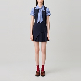 Model wearing Claude Pierlot Womens French Dress in black, styled with striped shirt, navy bow tie, red socks and brown loafers