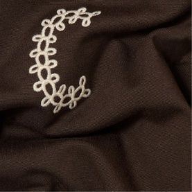Claude Pierlot brown fabric detail with cream floral lace trim embellishment, close-up texture shot