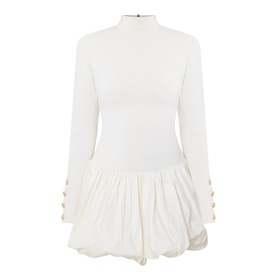 Aje cream mini dress with high neck, long sleeves, gold button cuff detail, and gathered bubble hem skirt