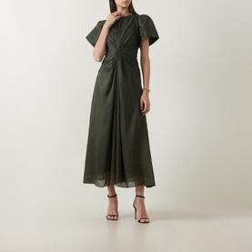 Model wearing Aje dark olive midi dress with flutter sleeves, twisted front detail and flared skirt, styled with black heeled sandals.