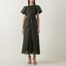 Model wearing Aje dark olive midi dress with puff sleeves, gathered twist front detail, and A-line skirt, styled with strappy heeled sandals.