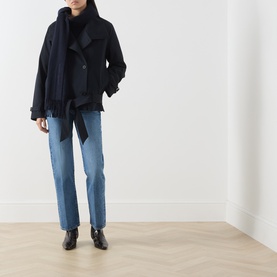 Model wearing Citizens of Humanity Straight Jeans in pastis, styled with a navy belted wool jacket, dark scarf and black ankle boots.