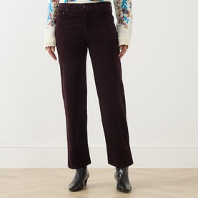 Model wearing Citizens of Humanity straight jeans in eggplant, styled with a floral top and black ankle boots.
