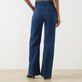 Model wearing Citizens of Humanity Wide Leg Jeans in elm, rear view showing high waist, five-pocket styling and wide-leg silhouette