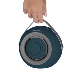 Dimplex Desk Friend Desk Fan Heater in blue, circular portable design with grey speaker grille and carry handle, held by hand.