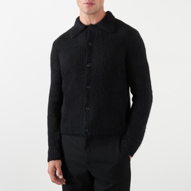 Model wearing Dries Van Noten Mora Brushed Knitted Cardigan in black, featuring polo collar, front button fastening and ribbed trims, styled with