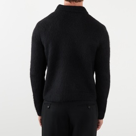 Model wearing Dries Van Noten Mora Brushed Knitted Cardigan in black, rear view showing brushed alpaca-wool knit and ribbed trims.