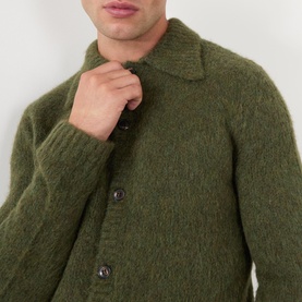 Model wearing Dries Van Noten Mora Brushed Knitted Cardigan in Forest Green, showing polo collar and front button fastening detail