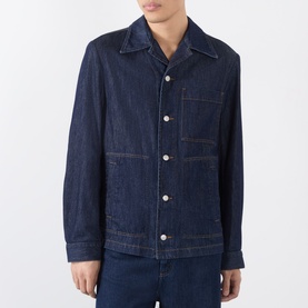 Model wearing Dries Van Noten Indigo Casual Jacket in denim with chest pockets, button front, and camp collar, styled with matching indigo jeans.