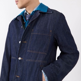 Model wearing Dries Van Noten Indigo Casual Jacket in denim with button front, styled over a teal shirt and collar.