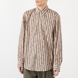 Model wearing Dries Van Noten Caper Printed Shirt in beige with vertical stripe and floral print, point collar, long sleeves, button front