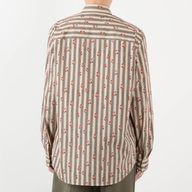Model wearing Dries Van Noten Caper Printed Shirt in beige, rear view showing striped pattern with floral detailing and long sleeves.