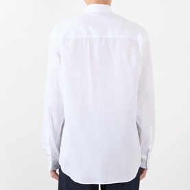 Model wearing Dries Van Noten white cotton casual shirt, rear view showing back yoke and button cuffs