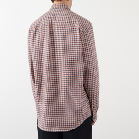 Model wearing Dries Van Noten red check cotton casual shirt, back view, with dark trousers