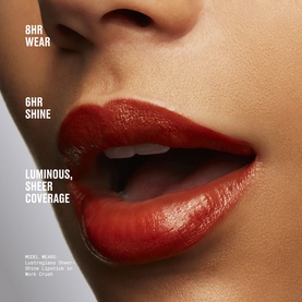 MAC Lustreglass Sheer-Shine Lipstick in shade $ellout, a deep red-orange, shown on model's lips with 8HR wear claim