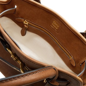 Miu Miu Rovere calfskin leather crossbody bag interior, cream lining, zip pocket and gold-tone hardware detail visible