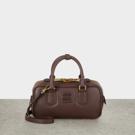 Miu Miu Radica calfskin shoulder bag with dual top handles, gold-tone hardware, and detachable crossbody strap