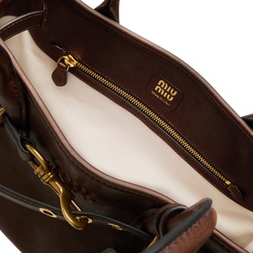 Miu Miu lambskin tote in Radica brown, interior view showing cream lining, gold-tone zip and branded tab