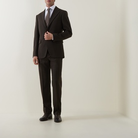 Model wearing Tiger of Sweden 1903 Single-Breasted Blazer in coffee with matching trousers, white shirt and brown tie