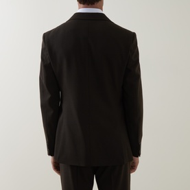 Model wearing Tiger of Sweden 1903 Single-Breasted Blazer in coffee, rear view showing double back vents and kissing sleeve buttons.