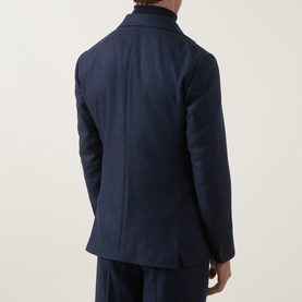 Model wearing Tiger of Sweden Easer Single-Breasted Suit Jacket in Sea navy, back view, paired with matching trousers.