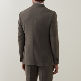 Model wearing Tiger of Sweden Stone Suit Jacket, rear view, paired with matching stone suit trousers