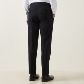 Model wearing Tiger of Sweden Blue Function Suit Trouser, wool blend, slim fit, rear view, styled with white shirt and black Oxford shoes