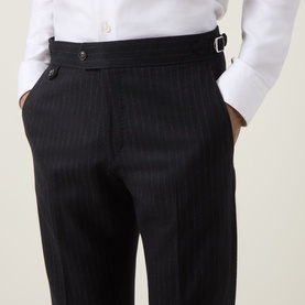 Model wearing Tiger Sweden Suit Trouser in Blue Funcrion, pinstripe, with side adjusters, styled with white shirt
