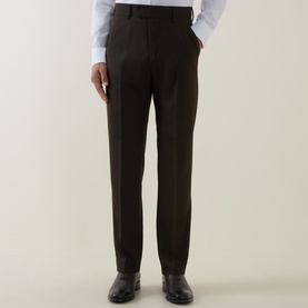 Model wearing Tiger of Sweden Tenser Slim Suit Trousers in Coffee, slim leg with pressed creases, styled with a white shirt and black shoes.