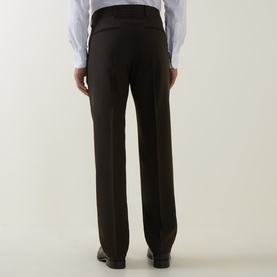 Model wearing Tiger of Sweden Tenser Slim Suit Trousers in Coffee, rear view showing pressed creases and rear welt pockets, styled with white shirt