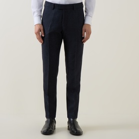 Model wearing Tiger of Sweden Midnight Blue wool-blend suit trousers, styled with black leather loafers and white shirt.