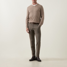 Model wearing Tiger of Sweden Beige Melange wool V-neck jumper, styled with khaki slim-fit trousers and black leather shoes.